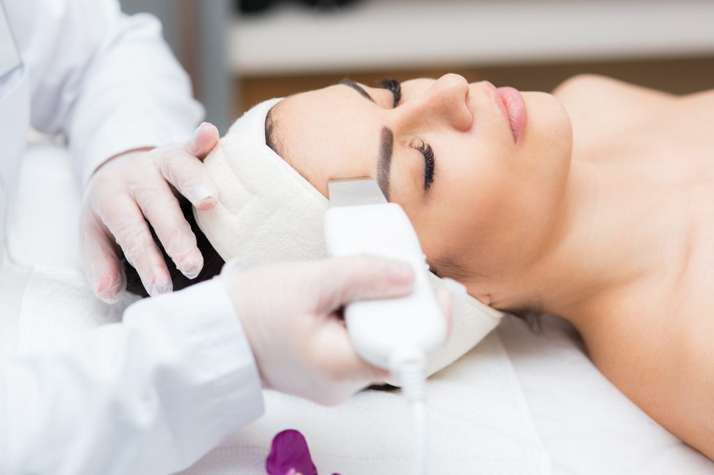 Beautiful woman in professional beauty salon during rejuvenation procedure.