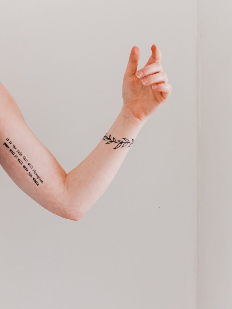 Arm and wrist tattoo visible before laser tattoo removal session