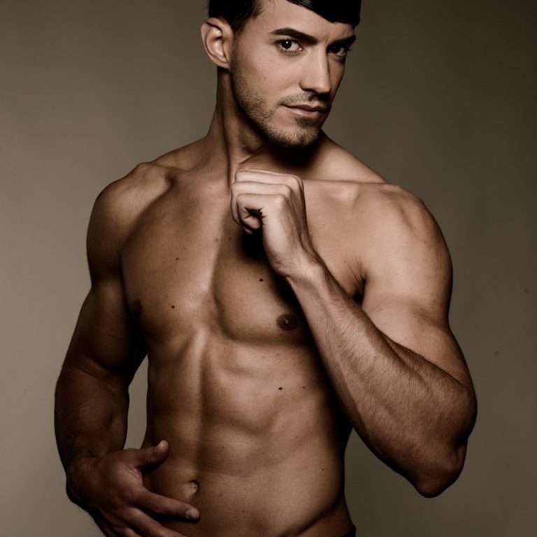 topless man wearing black shorts